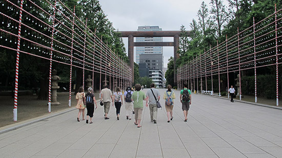 Students walking outside in a row at Yasukuni Jinja Shrine in Tokyo