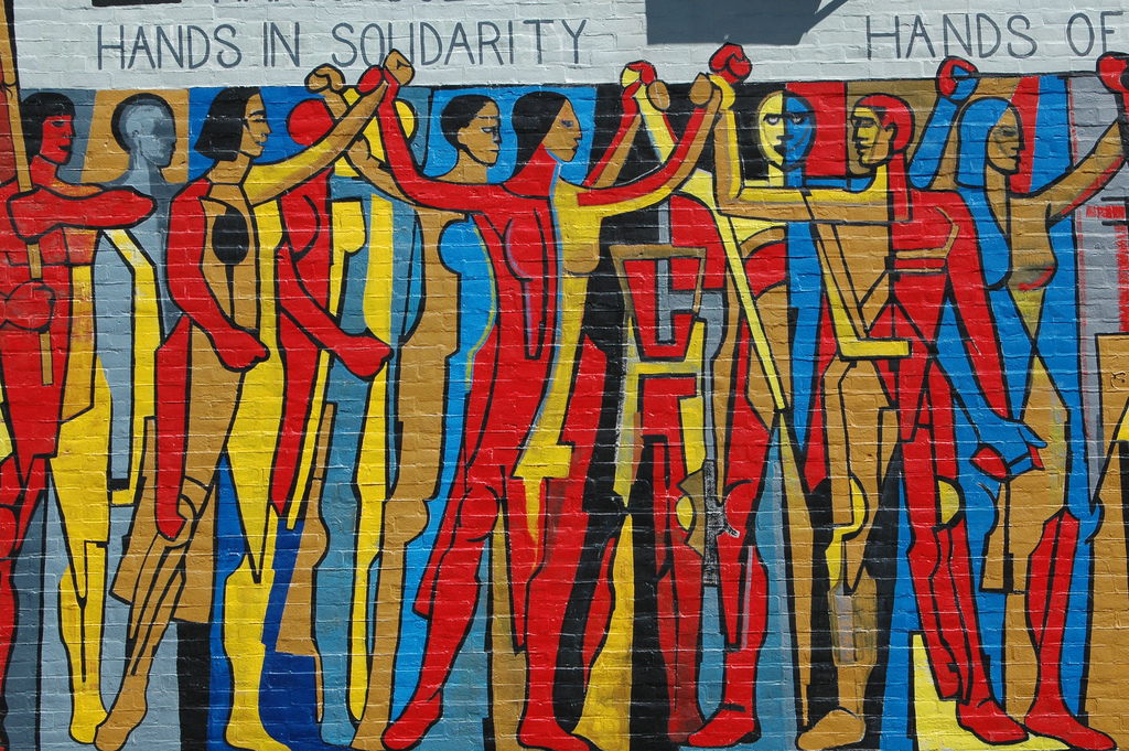 Hands in Solidarity, Hands of Freedom mural on the side of the United Electrical Workers trade union building on West Monroe Street at Ashland Avenue in Chicago, Illinois.