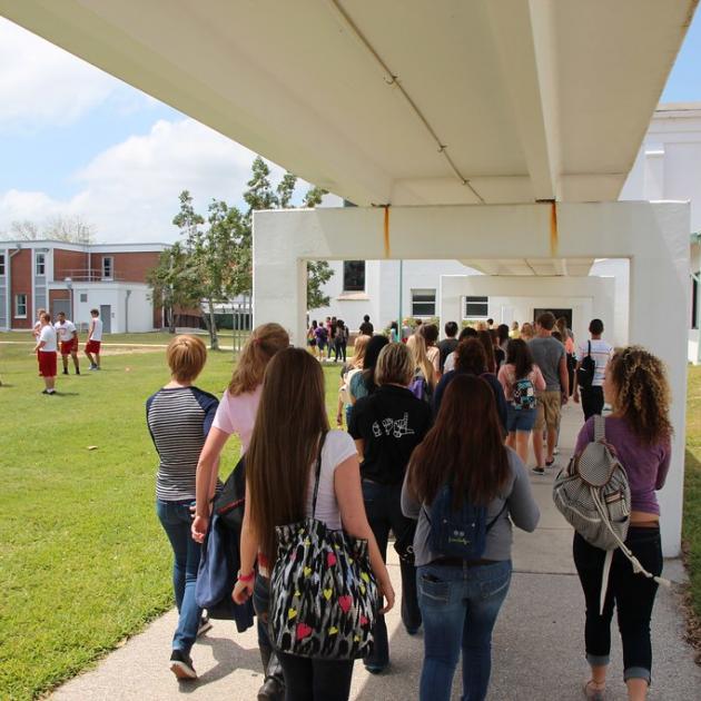students entering a school in Pasco County, FL