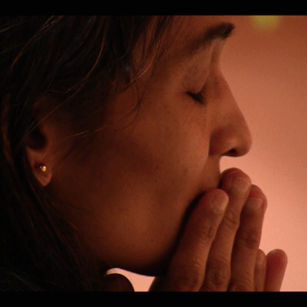 Close up shot of woman in prayer