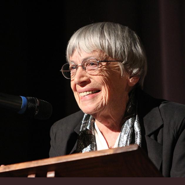 Ursula Le Guin speaks at a podium in 2013. Photo by Jack Liu.