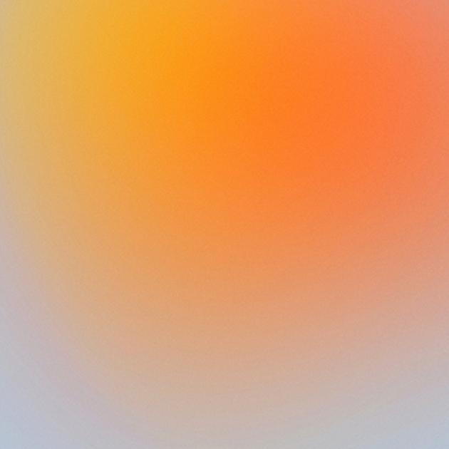 abstract image of a yellow and orange circle blurring into a light blue background